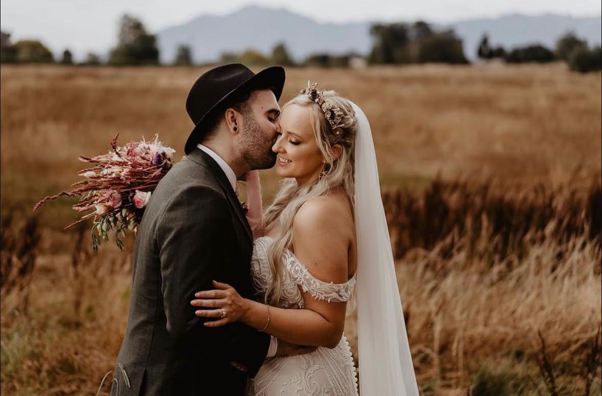 Romantic couple kiss in golden field